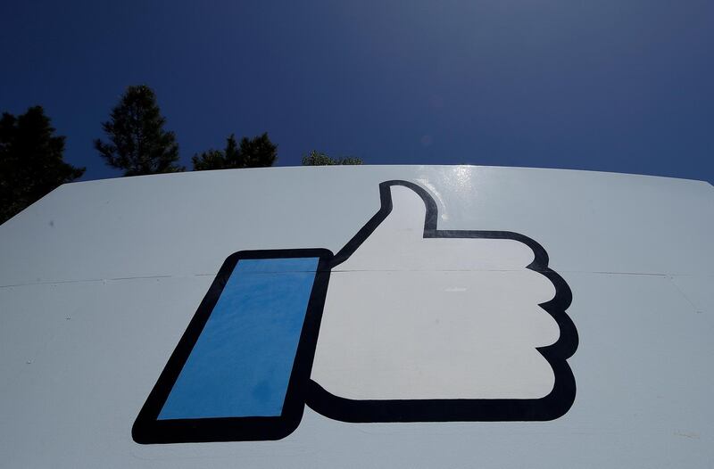 FILE - This April 25, 2019, file photo shows the thumbs-up "Like" logo on a sign at Facebook headquarters in Menlo Park, Calif. Facebook, following in Googleâ€™s footsteps, says it plans to invest $1 billion to support the news industry over the next three years. The social networking giant, which has been tussling with Australia over a law that would make social platforms pay news organizations, said it has invested $600 million since 2018 for news. (AP Photo/Jeff Chiu, File)