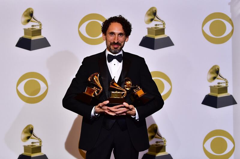 Jazz musician John Daversa poses with his three Grammys in the press room. AFP