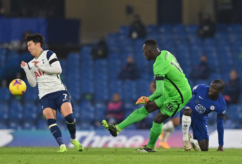 Chelsea goalkeeper Edouard Mendy  clears the ball past Spurs attacker Son Heung-min. AFP