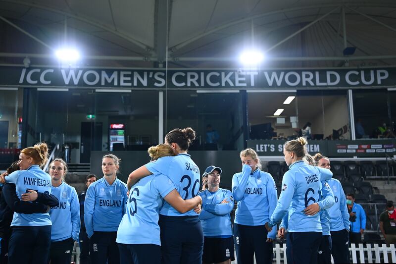 England players console each other after defeat in the 2022 Cricket World Cup final to Australia. Getty