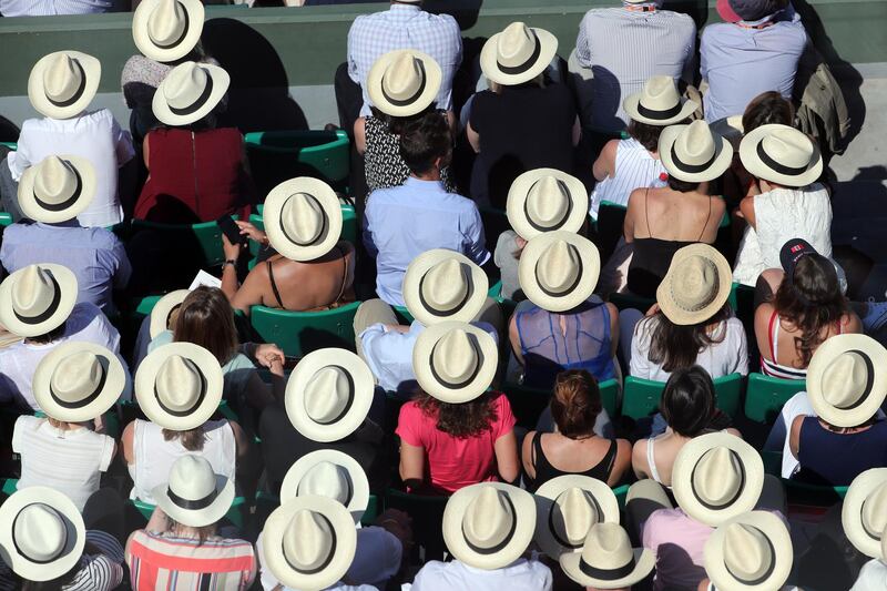 Spectators watch matches at the French Open. EPA