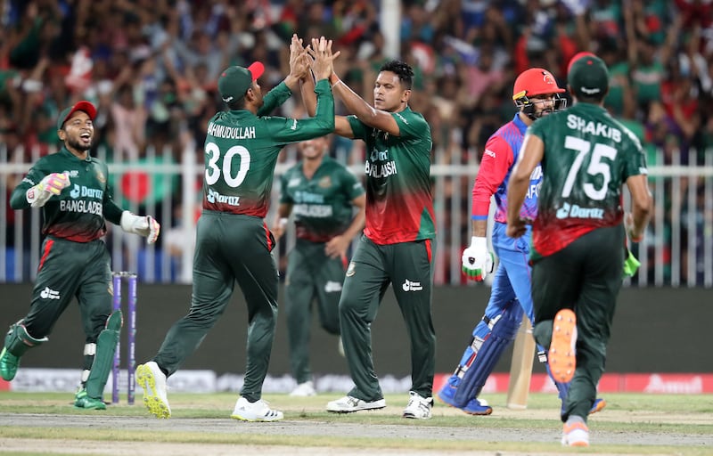 Bangladesh players celebrate the wicket of Afghanistan captain Mohammad Nabi for eight.