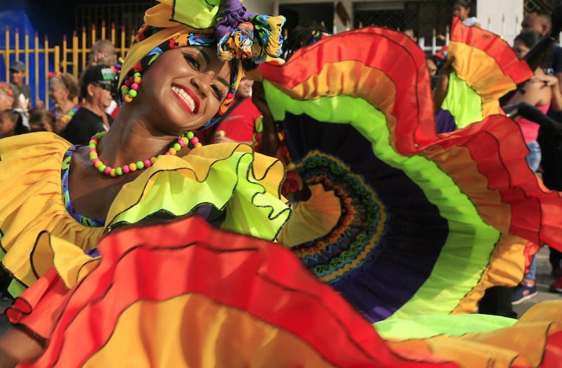 A woman takes part in the Getsemani Assembly parade in Cartagena de Indias, Bolivar, Colombia. The Cartagena festivities commemorate the Colombian city's declaration of independence from Spain. Ricardo Maldonado Rozo / EPA