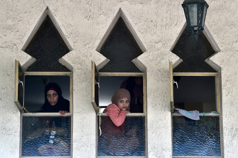 Palestinians who fled their homes in the Ain Al Hilweh camp rest in a mosque in Sidon, Lebanon on 1 August 2023. Residents said they are bracing for more battles. EPA