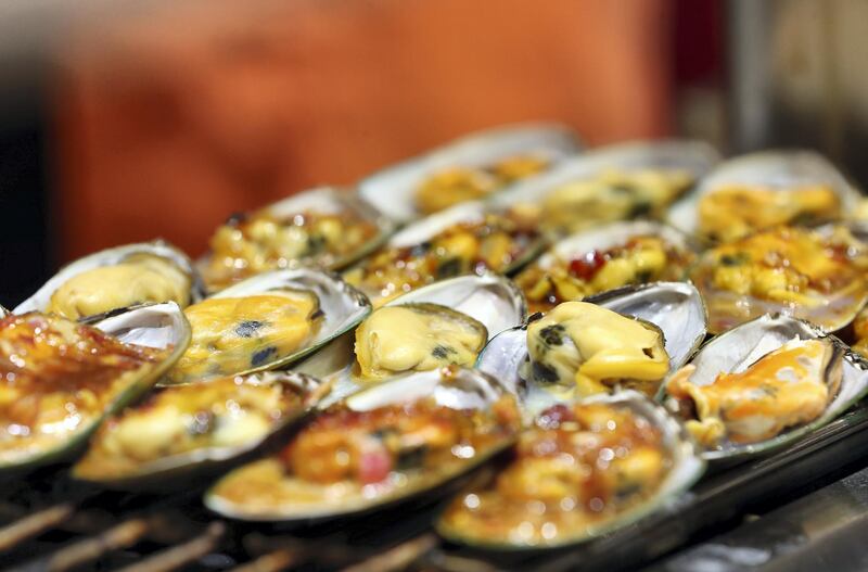 Dubai, United Arab Emirates - Reporter: Janice Rodrigues. Lifestyle. Food. Muscles are served on the Floating Market. Food vendors from all over the world at Gobal Village. Dubai. Sunday, January 17th, 2021. Chris Whiteoak / The National