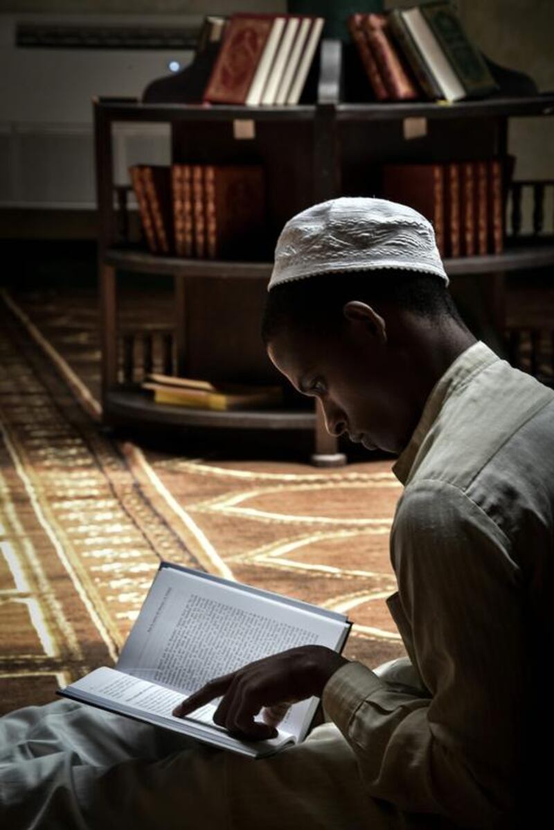 A Muslim Cuban man reading the Quran at the Abdallah mosque.