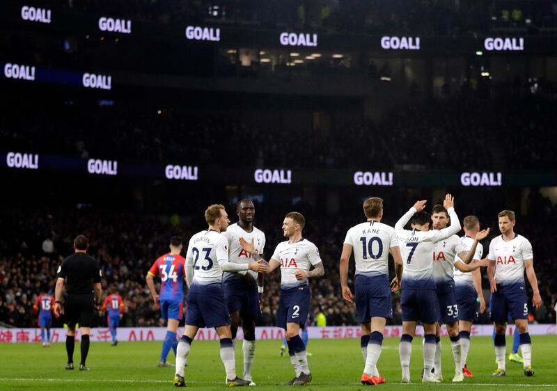 Tottenham's Christian Eriksen, foreground left, celebrates after scoring his side's second goal. EPA