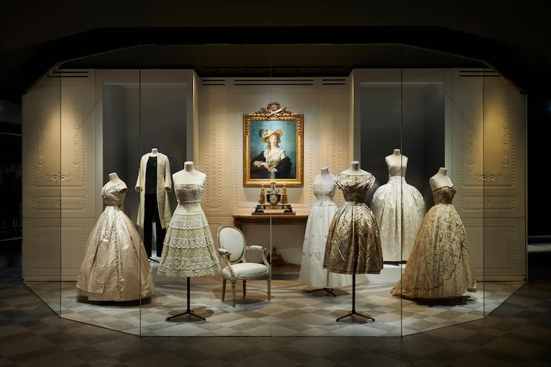 A room of pale gowns in the Christian Dior: Designer Of Dreams exhibition. Photo by Adrien Dirand