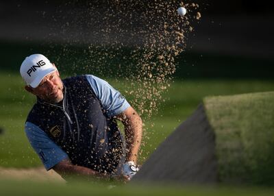 England's Lee Westwood plays a bunker shot on the 10th hole during the first round of the Dubai Desert Classic golf tournament in Dubai, United Arab Emirates, Thursday, Jan. 23, 2020. (AP Photo/Kamran Jebreili)