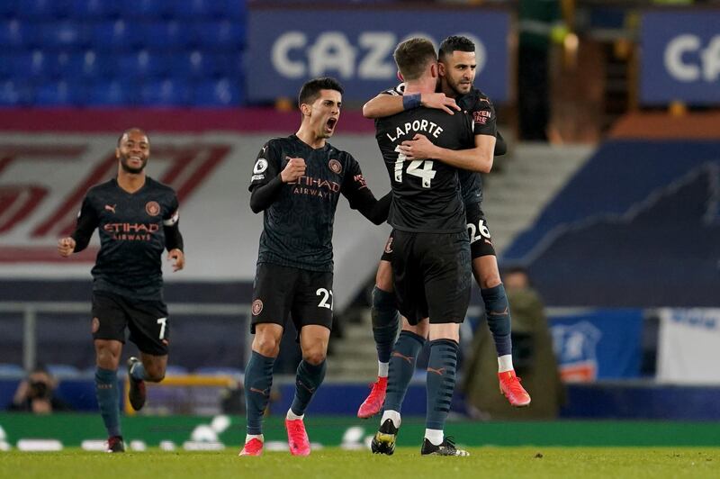 Riyad Mahrez, right, celebrates scoring City's second. AP