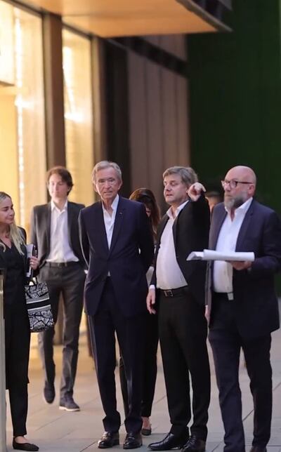 LVMH head Bernard Arnault, centre, visits Beijing with two of his children. Photo: Weibo