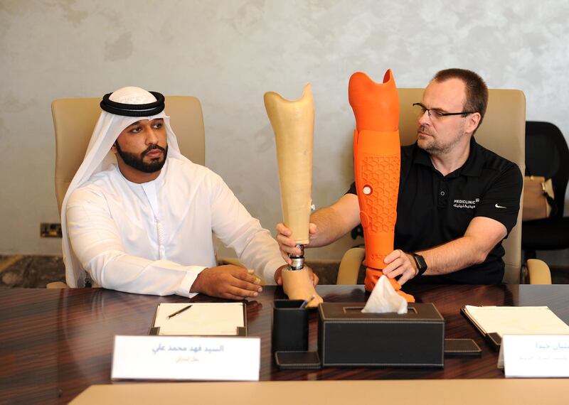 Fahad Ali, a long-term amputee, compares conventional prosthetics with his new 3D printed prosthetics with Sebastian Giede, a certified orthopaedic prosthetist with Mediclinic. Dubai Health Authority