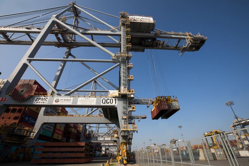 A gantry crane carries shipping containers away from a ship at London Gateway port, operated by DP World Plc, in Stanford-le-Hope, U.K., on Tuesday, Sept. 22, 2020. France said the European Union should keep pursuing a free-trade agreement with the U.K. while warning that any British violation of the Brexit agreement would end the push. Photographer: Chris Ratcliffe/Bloomberg