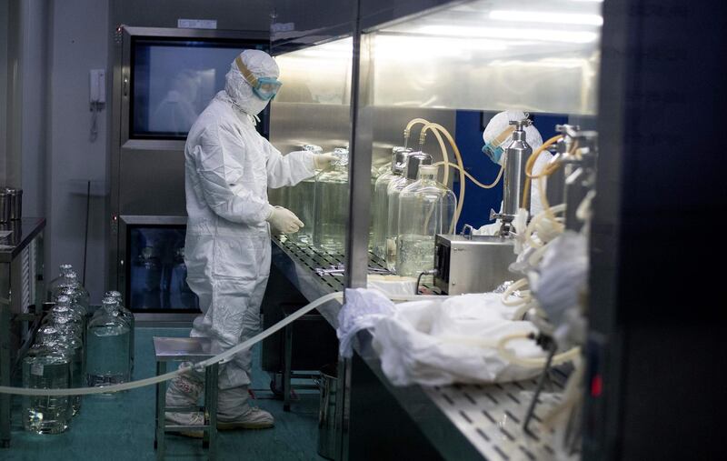 A researcher works in a lab at the Yisheng Biopharma company in Shenyang, in China’s northeast Liaoning province. The company is one of a number in China trying to develop a vaccine for the coronavirus.  AFP