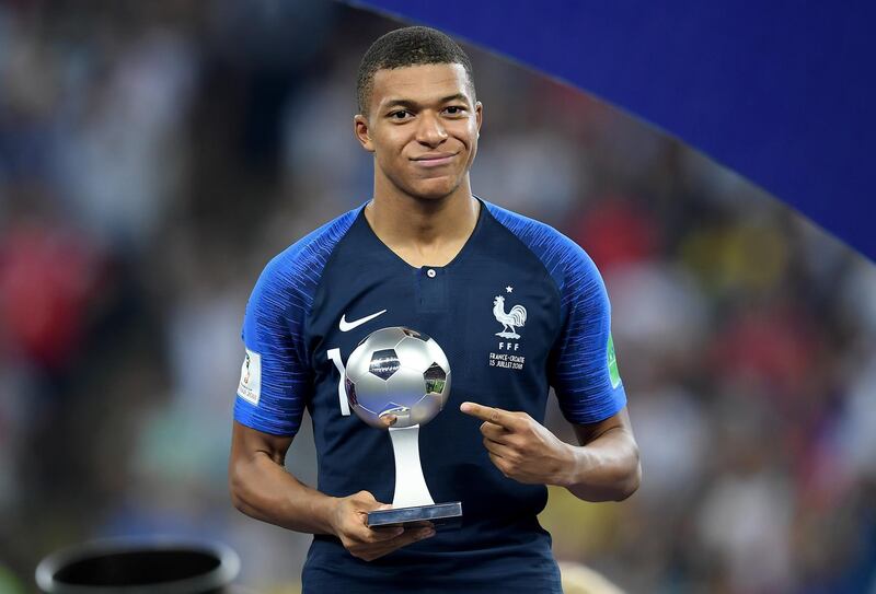 MOSCOW, RUSSIA - JULY 15:  Kylian Mbappe of France celebrates with his Best Young Player Award following the 2018 FIFA World Cup Final between France and Croatia at Luzhniki Stadium on July 15, 2018 in Moscow, Russia.  (Photo by Matthias Hangst/Getty Images)