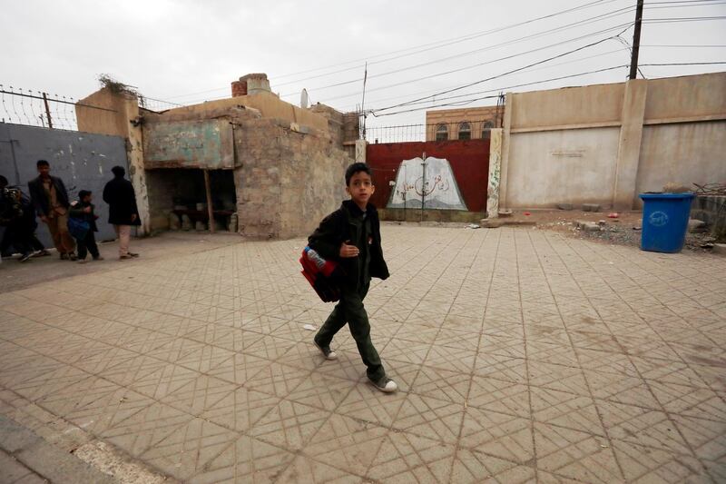 epa08995974 Yemeni schoolchildren arrive at a school to resume the second term of classes in Sana'a, Yemen, 08 February 2021. According to Yemenâ€™s education ministry, some five million Yemeni students attend school across the war-torn country while over half a million school-age children do not get to go to school since the escalating fighting broke out in 2015.  EPA/YAHYA ARHAB