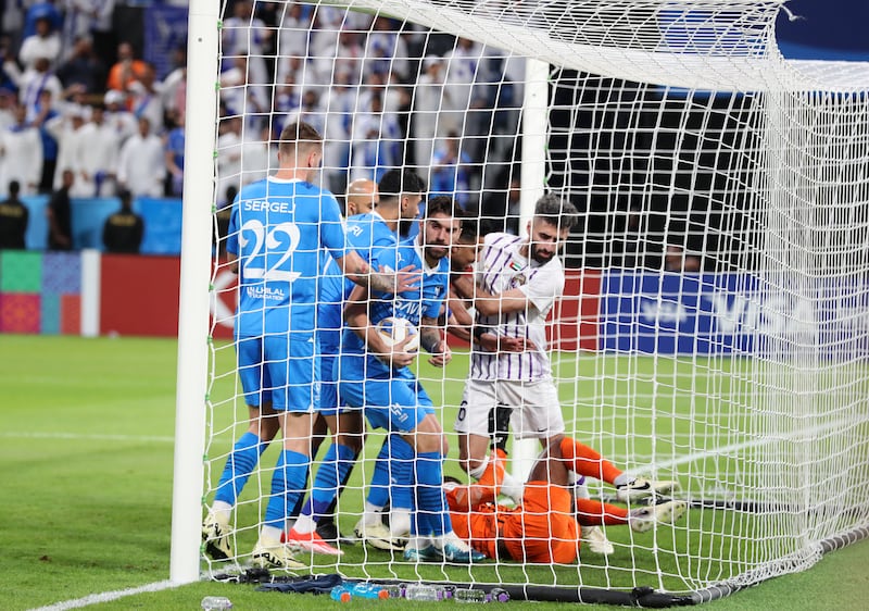 Al Hilal's Ruben Neves retrieves the ball after scoring their opener. 