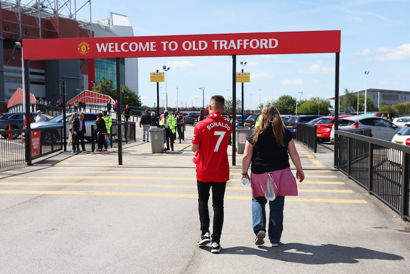 Manchester United fans arrive at Old Trafford on Sunday. Getty