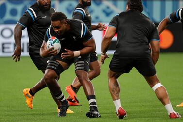Fiji player Viliame Mata, with the ball, was working as a joiner before being spotted by the country's sevens coach and winning Olympic gold in 2016. AP