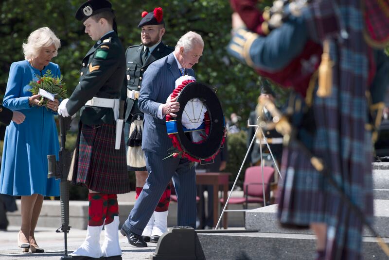 Prince Charles and Camilla, Duchess of Cornwall participate in a wreath laying National War Memorial in Ottawa, during their Canadian Royal tour, on Wednesday, May 18, 2022. AP