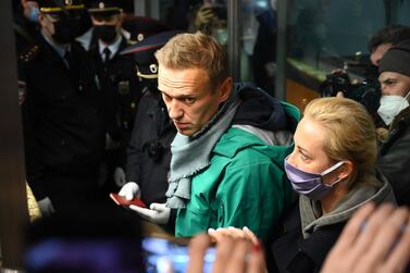 Russian opposition leader Alexei Navalny and his wife Yulia are seen at the passport control point at Moscow's Sheremetyevo airport on January 17, 2021. AFP