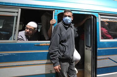 A man wearing a face mask rides a bus in Cairo, Egypt. EPA
