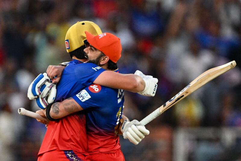Royal Challengers Bengaluru's Virat Kohli and Will Jacks celebrate after their team's win. AFP