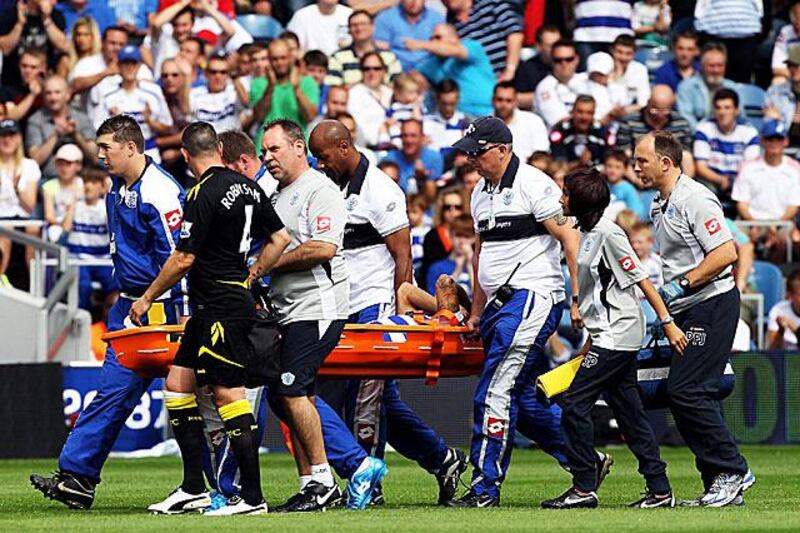 QPR midfielder Kieron Dyer leaves the pitch on a stretcher after just five minutes into his debut. QPR would go on to lose 4-0 to Bolton Wanderers.

Michael Steele / Getty Images