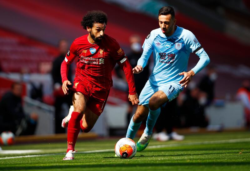 Liverpool's Mohamed Salah with Burnley's Dwight McNeil. Reuters