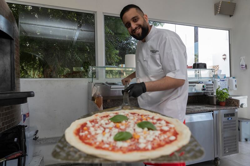 Emirati chef Sultan Kayed, 26, is the owner of burger joint Goat and Lit Pizzeria, which opened in Al Khawaneej this month, with two more sites set to open next year. All photos: Antonie Robertson / The National