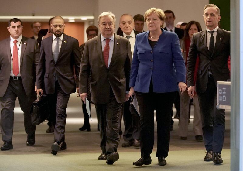 German Chancellor Angela Merkel, German Foreign Minister Heiko Maas (R) and Secretary-General of the United Nations (UN) Antonio Guterres leave after a press conference at the end of a Peace summit on Libya at the Chancellery in Berlin on January 19, 2020. Held under the auspices of the UN, the summit's main goal was to get foreign powers wielding influence in the region to stop interfering in the war -- be it through the supply of weapons, troops or financing. / AFP / POOL / Michael Kappeler
