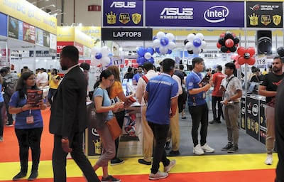 DUBAI,  UNITED ARAB EMIRATES , SEPTEMBER 24 – 2019 :- Visitors looking the electronic items during the Gitex Shopper held at Dubai World Trade Centre in Dubai. ( Pawan Singh / The National ) For News. Story by Patrick
