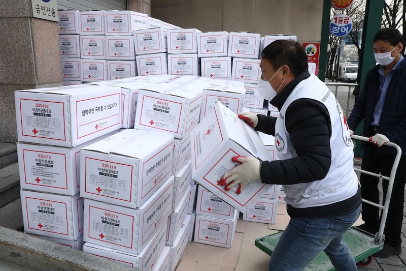 South Korean Red Cross workers prepare emergency relief kits packed with basic necessities for delivery to impoverished people experiencing difficulties amid the spread of coronavirus. Getty Images