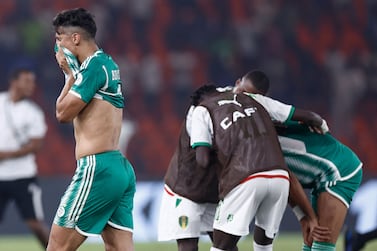 Algeria's forward #9 Baghdad Bounedjah reacts after Mauritania won the Africa Cup of Nations (CAN) 2024 group D football match between Mauritania and Algeria at Stade de la Paix in Bouake on January 23, 2024.  (Photo by KENZO TRIBOUILLARD  /  AFP)