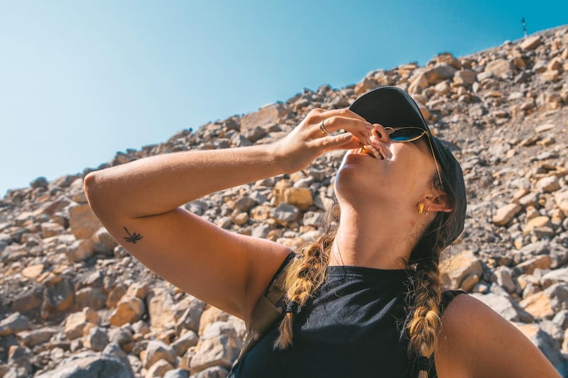 Grubs up: The National's Sophie Prideaux eats meal worms on the Bear Grylls Explorers Camp survival course.