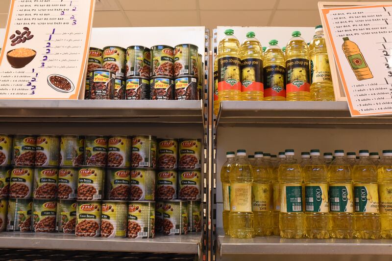 Cans of beans and bottles of oil are stored at the food bank.