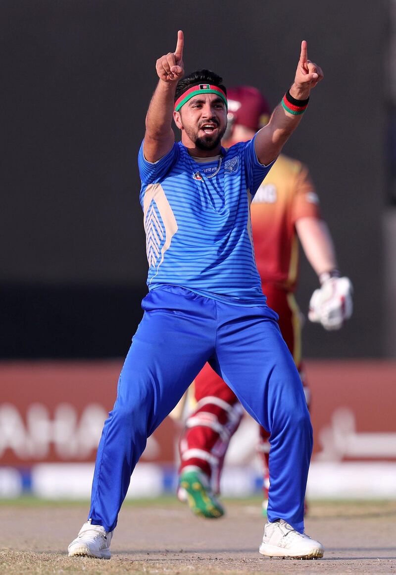 Sharjah, United Arab Emirates - October 18, 2018: Aftab Alam of the Balkh Legends takes the wicket of Paul Stirling of the Kandahar Knights during the game between Kandahar Knights and Balkh Legends in the Afghanistan Premier League. Thursday, October 18th, 2018 at Sharjah Cricket Stadium, Sharjah. Chris Whiteoak / The National