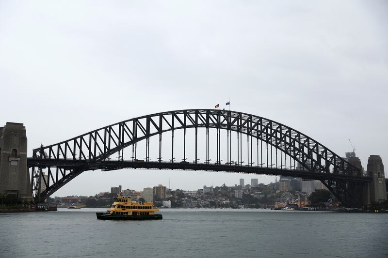 Flags are seen at half-mast on the Sydney Harbour ridge as a mark of mourning and respect for Queen Elizabeth. Getty