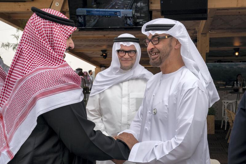 RIYADH, SAUDI ARABIA - December 15, 2018: HH Sheikh Mohamed bin Zayed Al Nahyan, Crown Prince of Abu Dhabi and Deputy Supreme Commander of the UAE Armed Forces (R) attends the final day of the 2018 Formula E Saudi Ad Diriyah E-prix.

( Mohamed Al Hammadi / Ministry of Presidential Affairs )
---