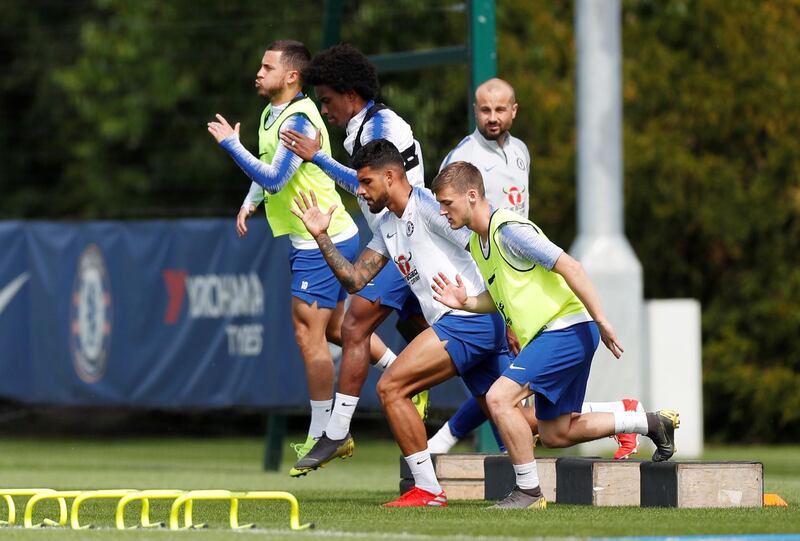 Chelsea's Emerson Palmieri, Eden Hazard and Willian with teammates during training. Reuters