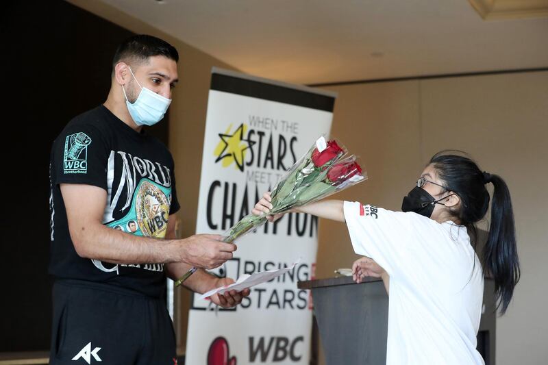 DUBAI, UNITED ARAB EMIRATES , December 28 – 2020 :- Suha Aziz giving flowers to Amir Khan, British professional boxer during the Rising Stars (people with determination) event held at the Fairmont The Palm hotel on Palm Jumeirah in Dubai. ( Pawan Singh / The National ) For News/Online/Instagram. Story by Kelly