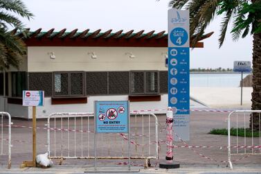 No entry signs at Corniche Beach in Abu Dhabi in April. Public beaches and parks were closed in March to prevent the spread of Covid-19. Victor Besa / The National 