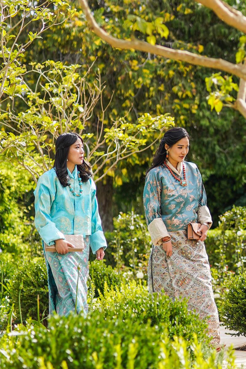 Bhutan's Queen Jetsun Pema and Princess Euphelma arrive wearing traditional Bhutanese outfits 
