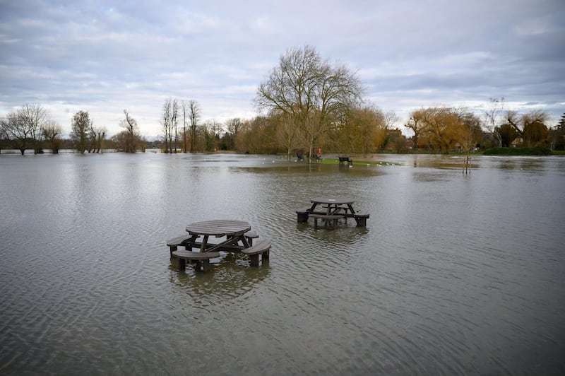 A picnic area is flooded after the River Great Ouse burst its banks in Godmanchester. Getty Images