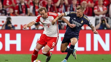 Munich's Harry Kane (L) in action against Madrid's Toni Kroos (R) during the UEFA Champions League semi final, 1st leg match between Bayern Munich and Real Madrid in Munich, Germany, 30 April 2024.   EPA / ANNA SZILAGYI