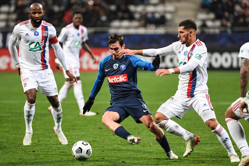 Lyon's French midfielder Houssem Aouar fights for the ball during the French Cup match against Paris FC. AFP
