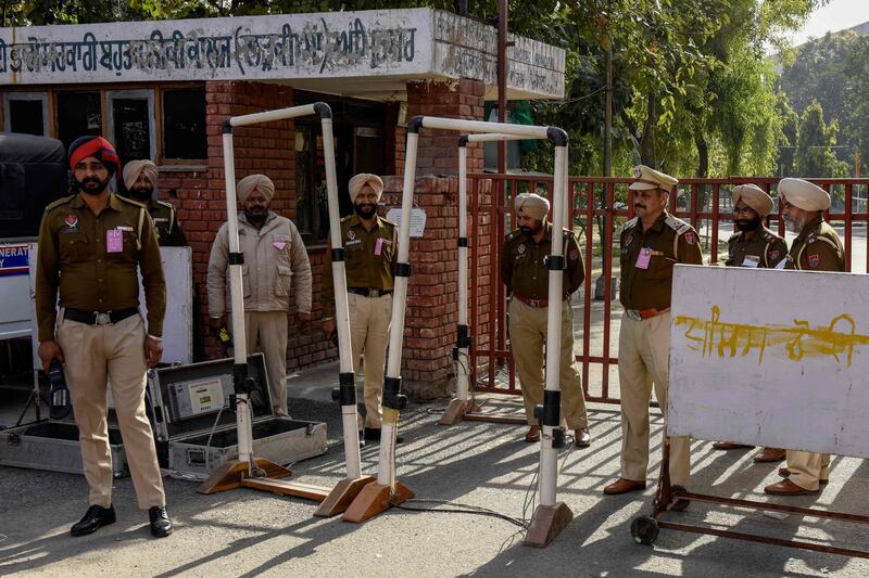 Police stand guard outside a counting centre in Amritsar, Punjab state. AFP