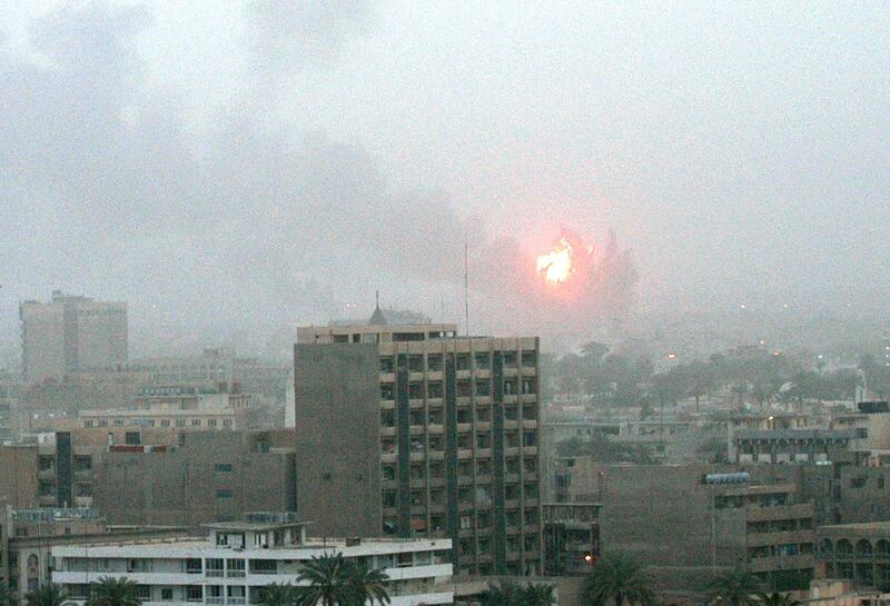 An explosion is seen in Baghdad 20 March, 2003, as the US launched a war on Iraq with air strikes on the capital, making good on threats of military action to push President Saddam Hussein out of power. US President George W. Bush announced 19 March he had launched war against Iraq. "My fellow citizens, at this hour American and coalition forces are in the early stages of military operations to disarm Iraq, to free its people and to defend the world from grave danger," Bush said.   AFP PHOTO  PATRICK BAZ (Photo by PATRICK BAZ / AFP)