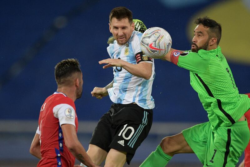 Argentina's Lionel Messi vies for the ball with Chile goalkeeper Claudio Bravo. AFP