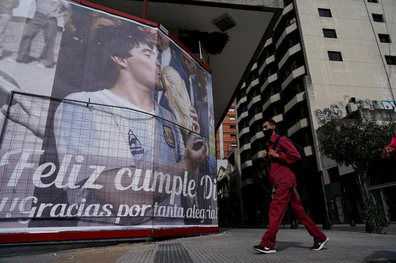 A billboard shows photos of Maradona and the Spanish message: "Happy Birthday Diego, thank you for so much happiness" in Buenos Aires. AP
